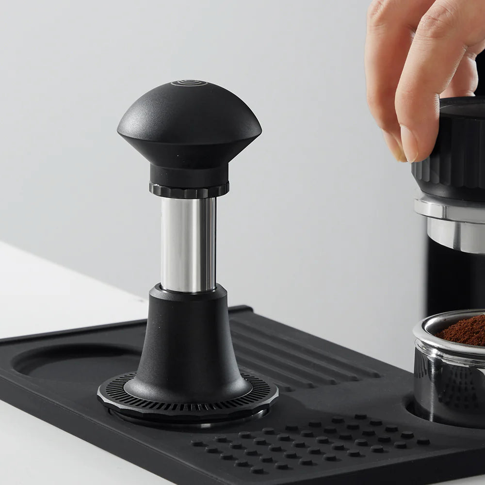 ZeroHero Tamper 58mm Black Adjust with base on a coffee station ready for use.