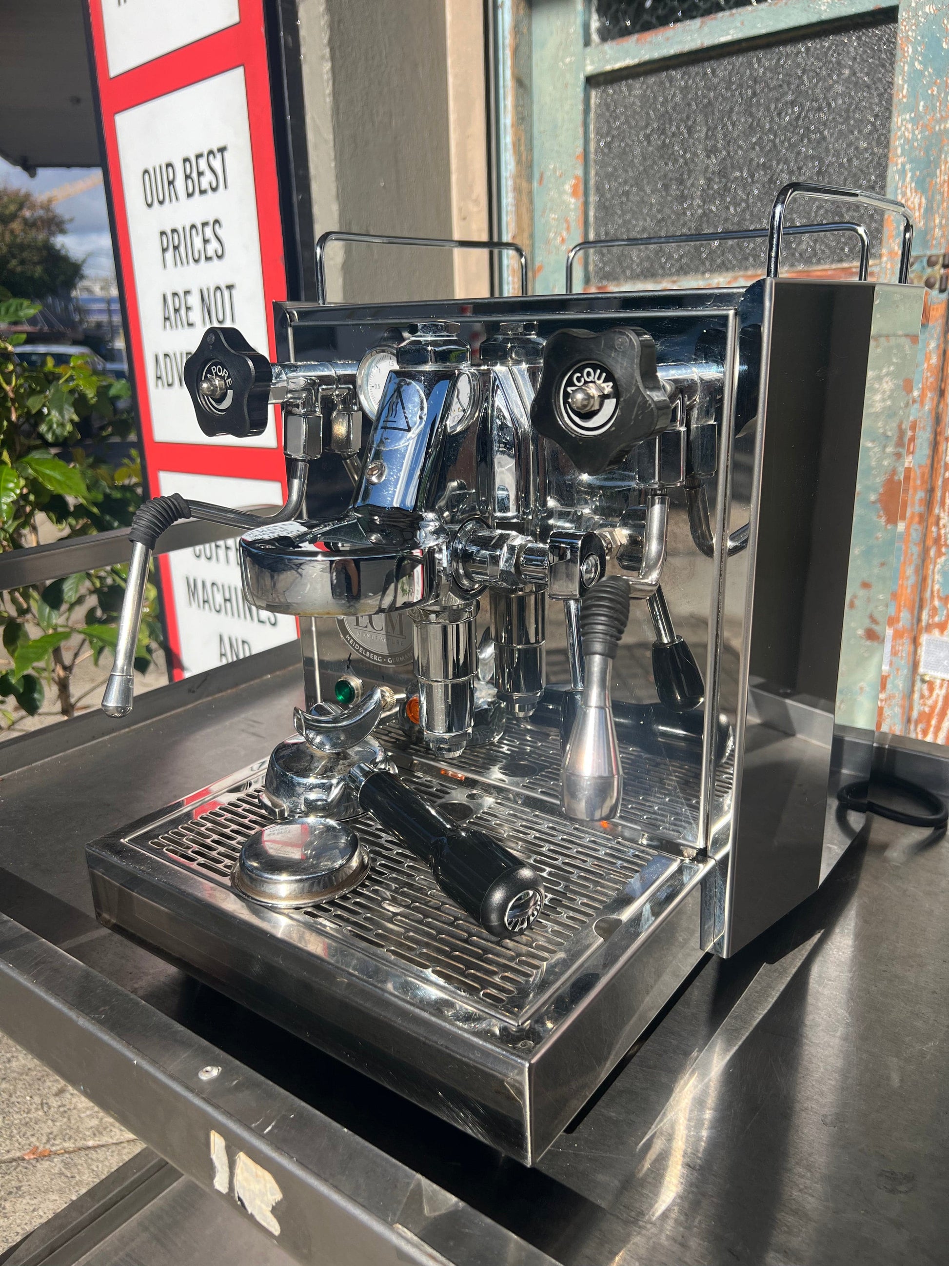 ECM Barista Coffee Machine on a stainless steel surface, showcasing its polished design and features.