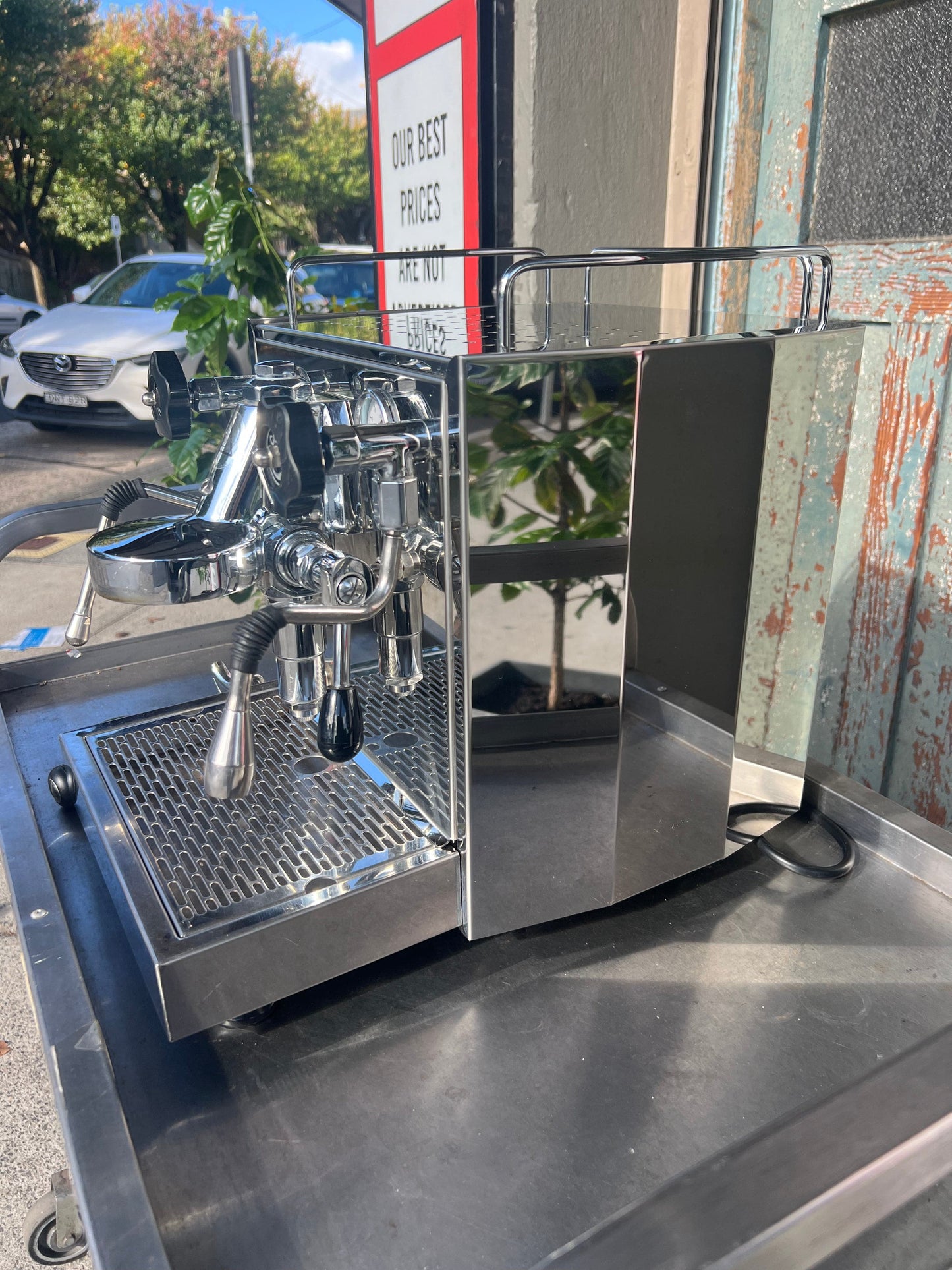 ECM Barista Coffee Machine on display, showcasing its polished stainless steel design and professional brewing components.