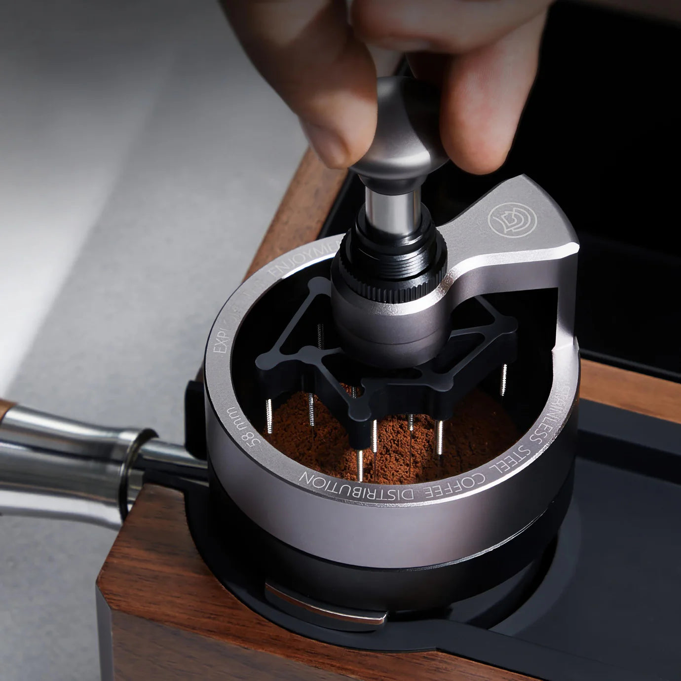 ZeroHero 58mm Sword Needle Distributor being used for precise coffee ground distribution.