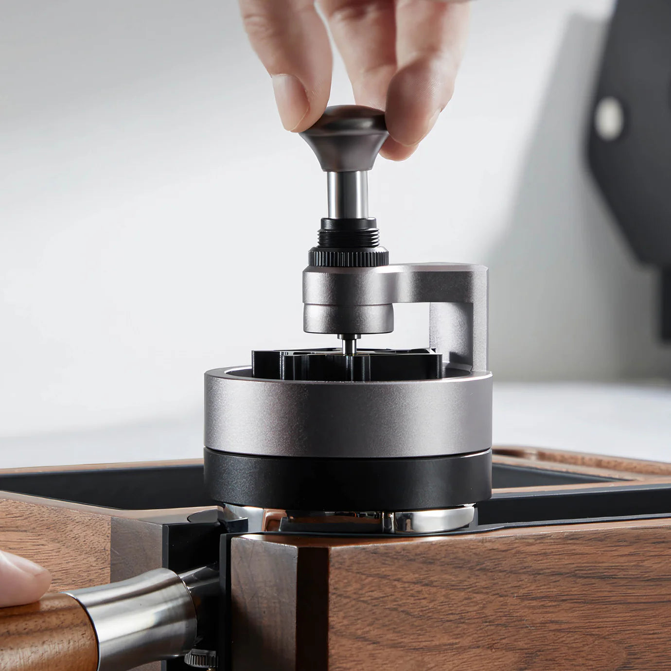 ZeroHero 58mm Sword Needle Distributor being used for precise coffee ground distribution.